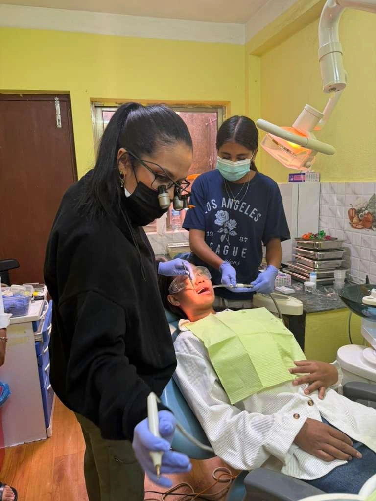 Sylvana Chimenti treating a patient during her mission trip to Nepal
